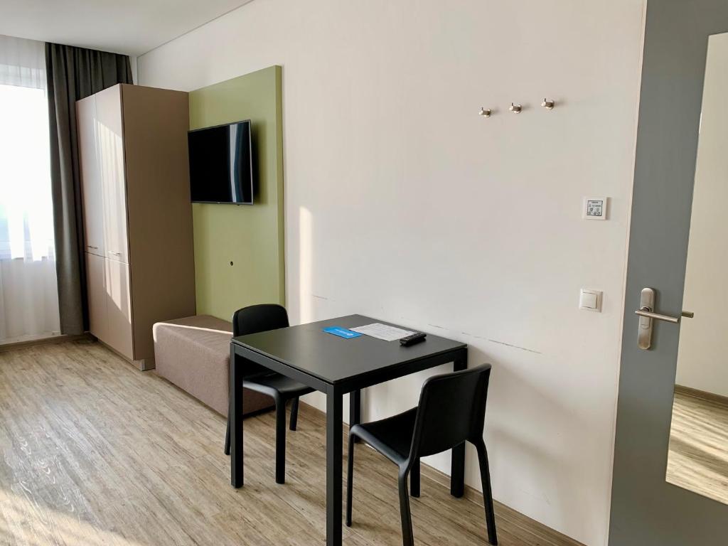 TV a/nebo společenská místnost v ubytování boardinghouse Main-Tauber