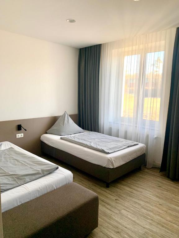 Postel nebo postele na pokoji v ubytování boardinghouse Main-Tauber