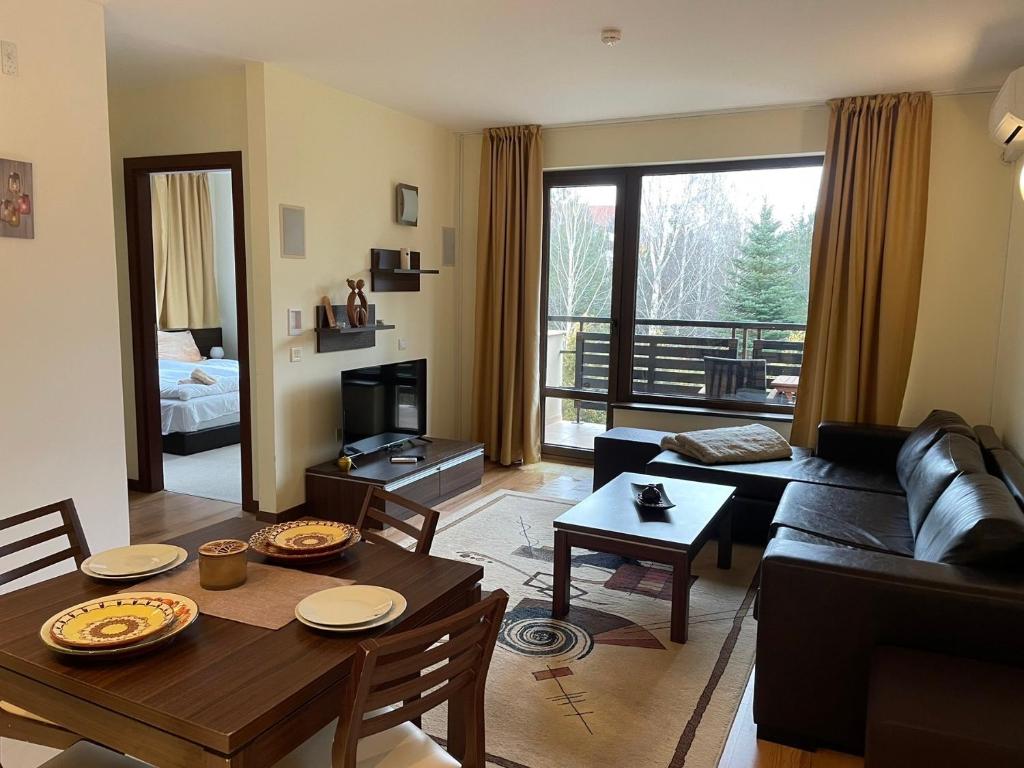 TV a/nebo společenská místnost v ubytování Terra SP apartments-Razlog