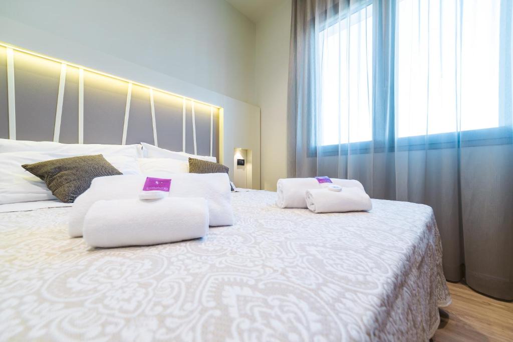 Postel nebo postele na pokoji v ubytování Hotel Calaluna