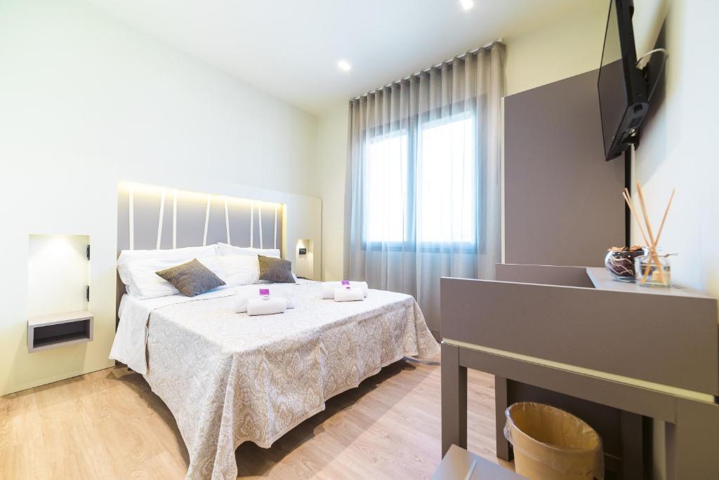 Postel nebo postele na pokoji v ubytování Hotel Calaluna