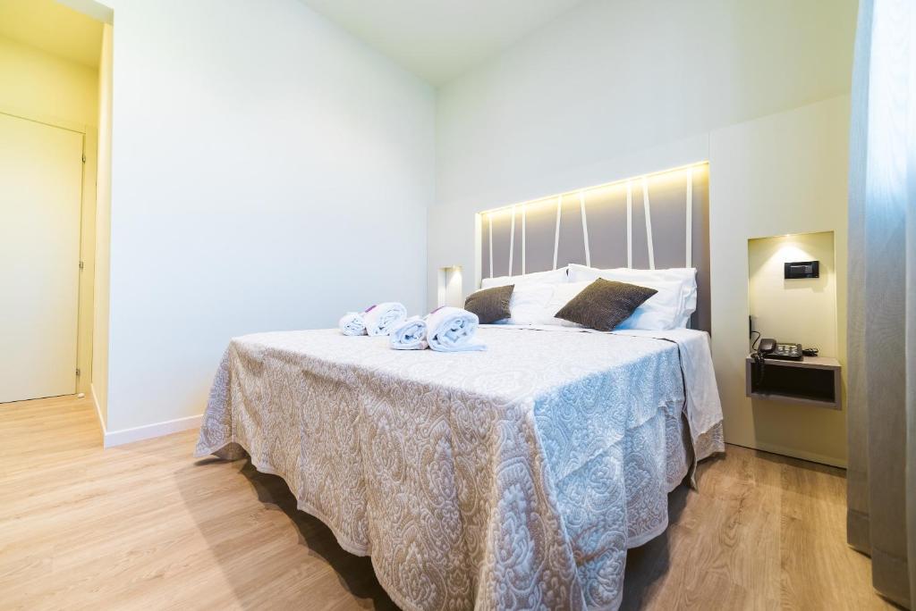 Postel nebo postele na pokoji v ubytování Hotel Calaluna