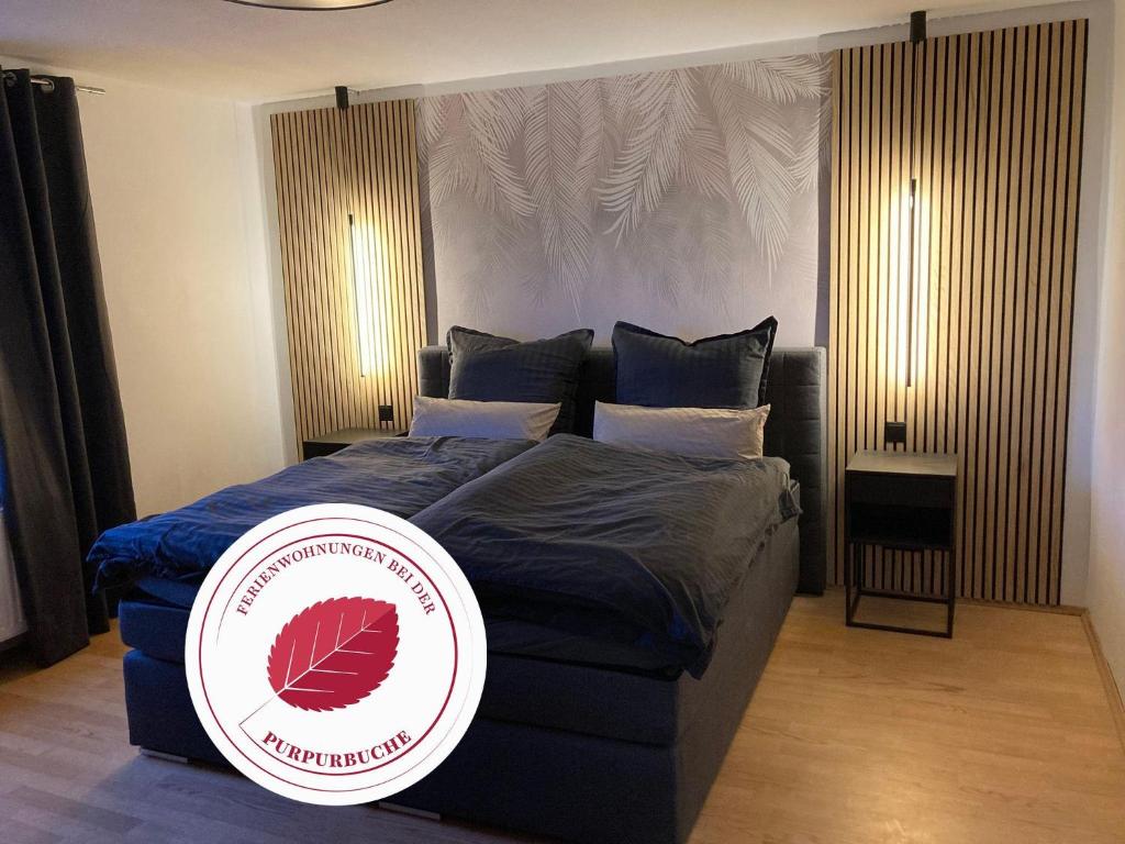 a bedroom with a bed with a frisbee on it at Gipfelglueck-bei-der-Purpurbuche in Bad Harzburg