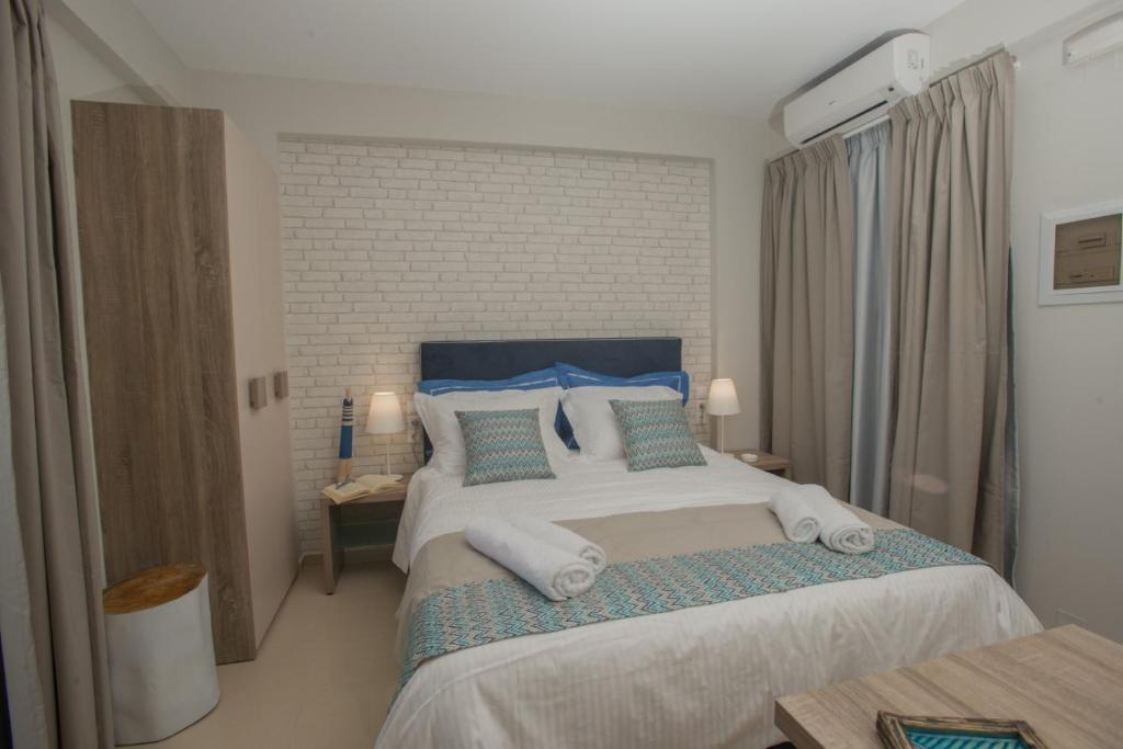 Postel nebo postele na pokoji v ubytování Athina Residence