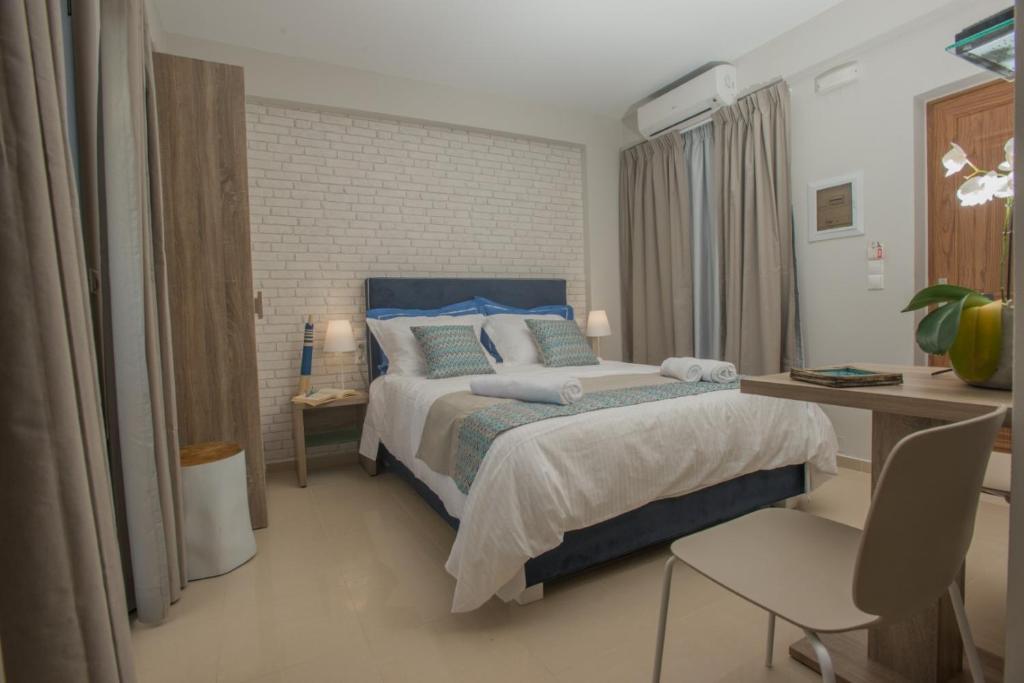 Postel nebo postele na pokoji v ubytování Athina Residence