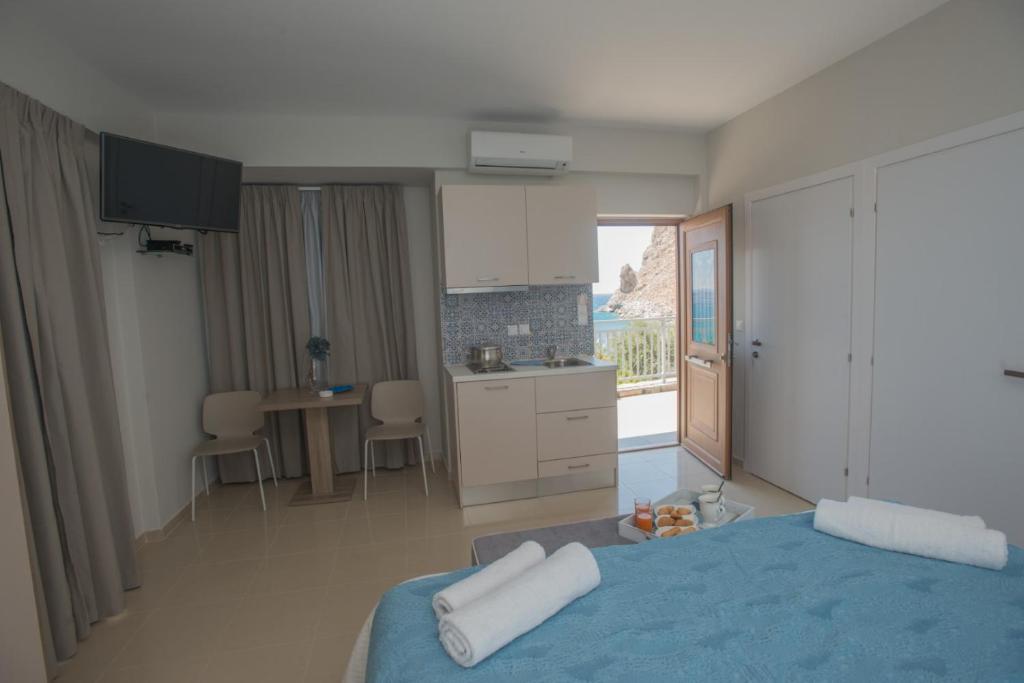 Postel nebo postele na pokoji v ubytování Athina Residence