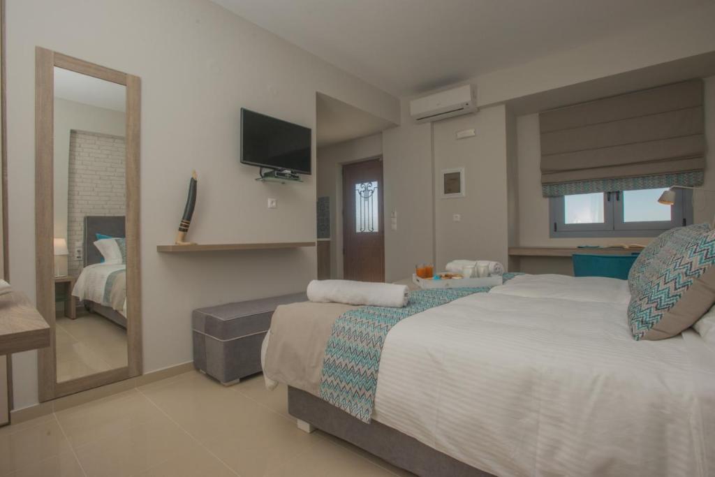 Postel nebo postele na pokoji v ubytování Athina Residence