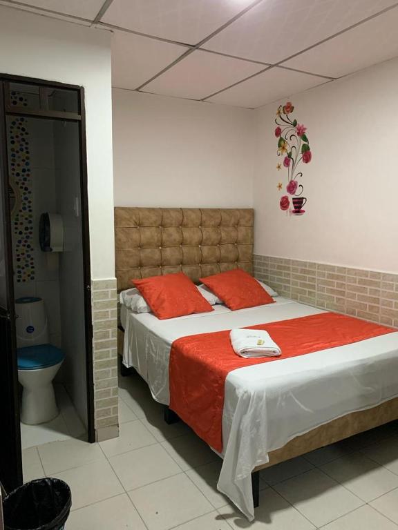 Postel nebo postele na pokoji v ubytování Hotel Mi Casita Pereira