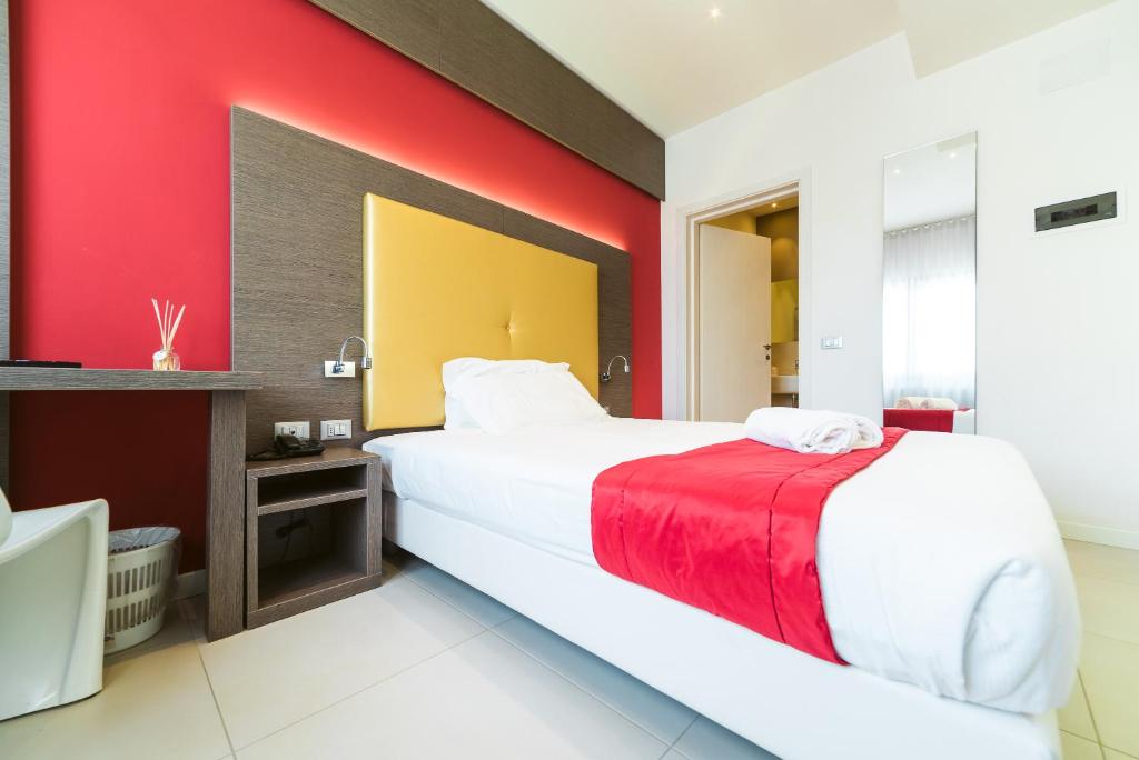 Postel nebo postele na pokoji v ubytování Hotel Calaluna