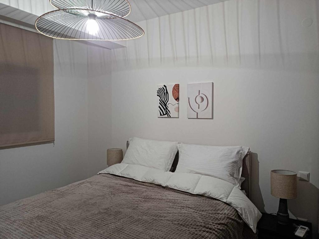 Postel nebo postele na pokoji v ubytování Morpheus boutique apartment