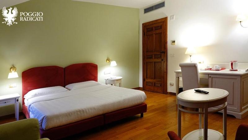 Postel nebo postele na pokoji v ubytování Poggio Radicati Hotel De Charme