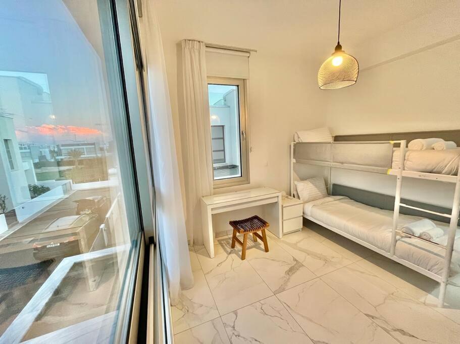 Postel nebo postele na pokoji v ubytování Sol e Mar Villa 2
