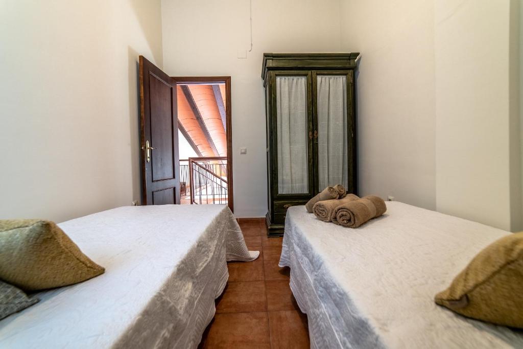 A bed or beds in a room at Casa El Oasis del Lago Alojamiento Rural