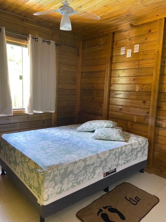 Säng eller sängar i ett rum på Recanto da Tia Juju