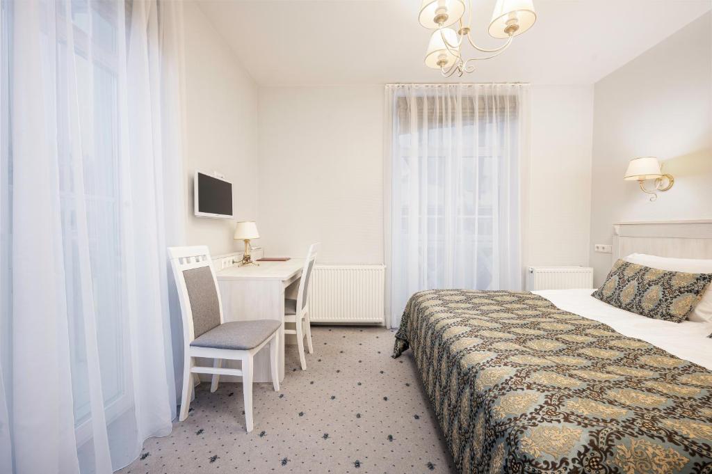 Postel nebo postele na pokoji v ubytování Art Hotel