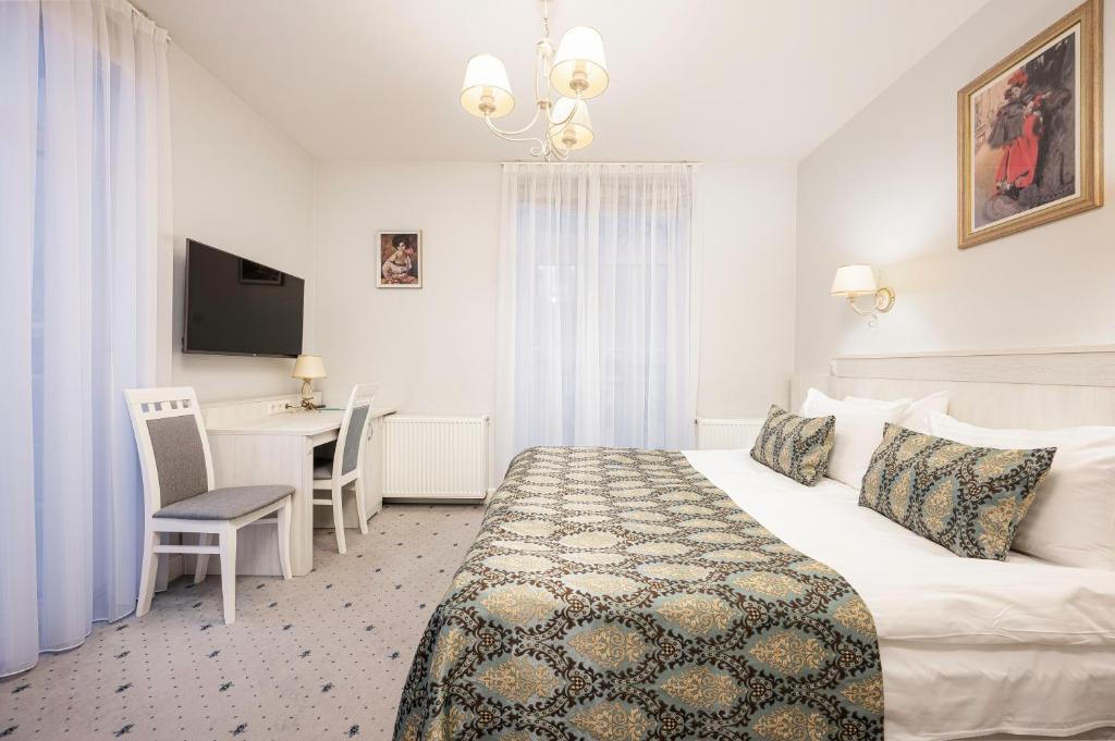 Postel nebo postele na pokoji v ubytování Art Hotel