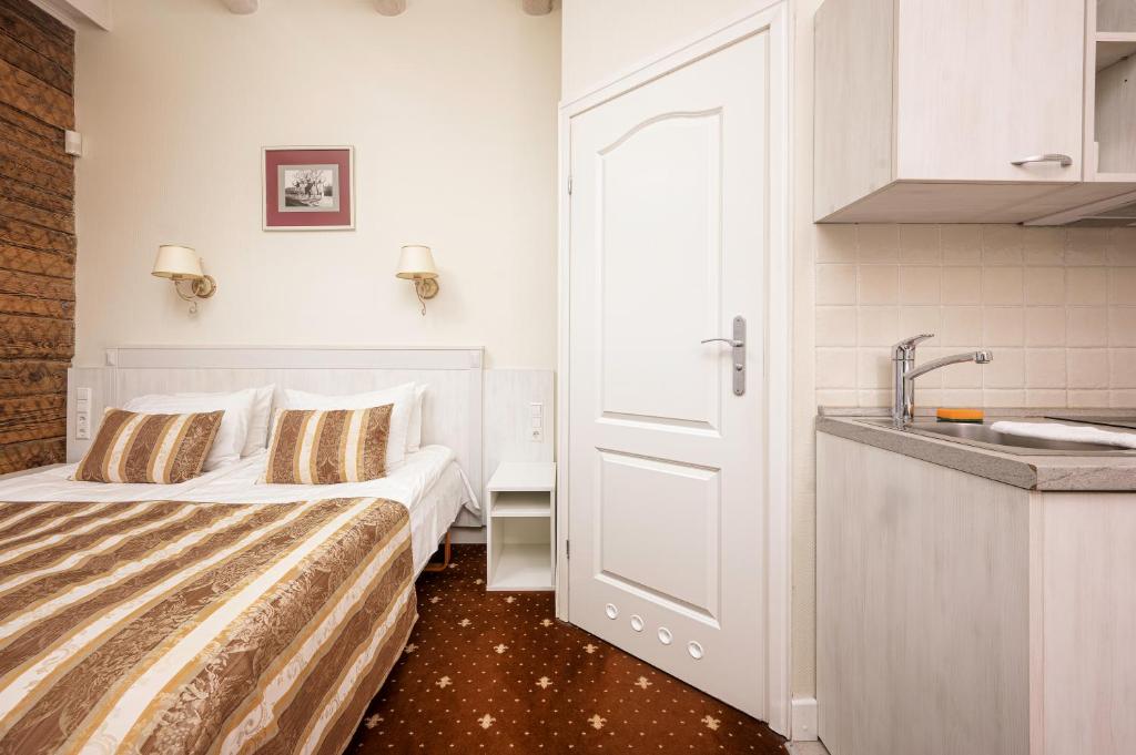 Postel nebo postele na pokoji v ubytování Art Hotel