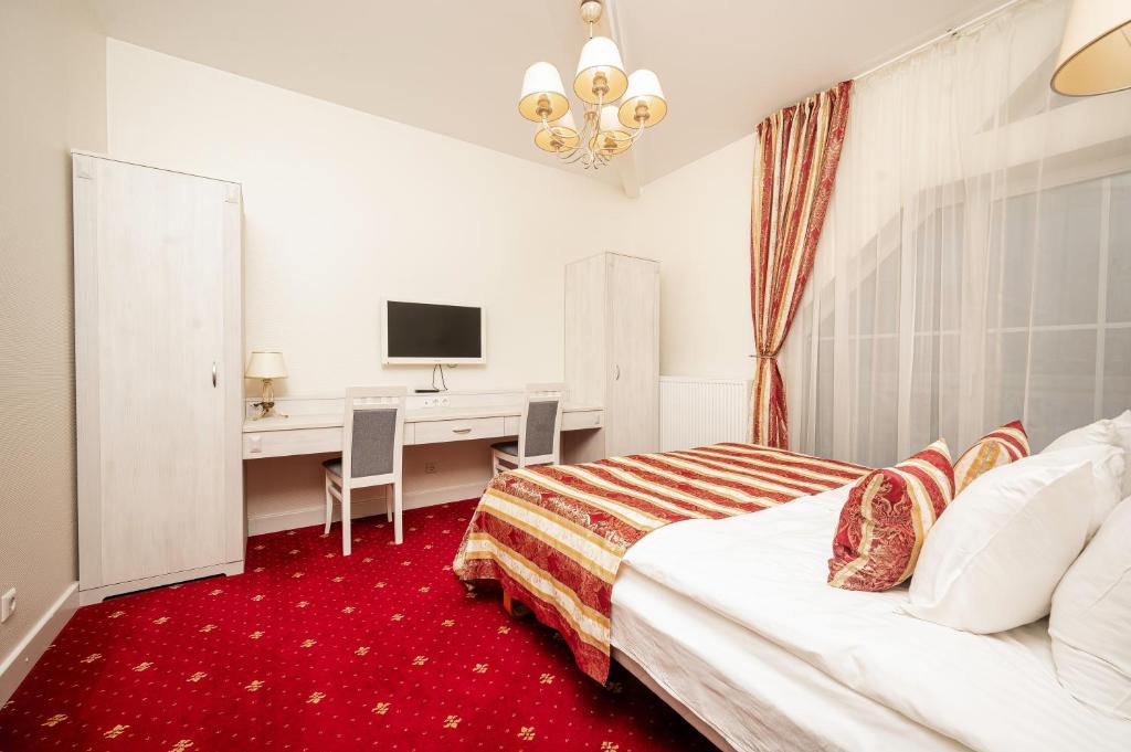 Postel nebo postele na pokoji v ubytování Art Hotel