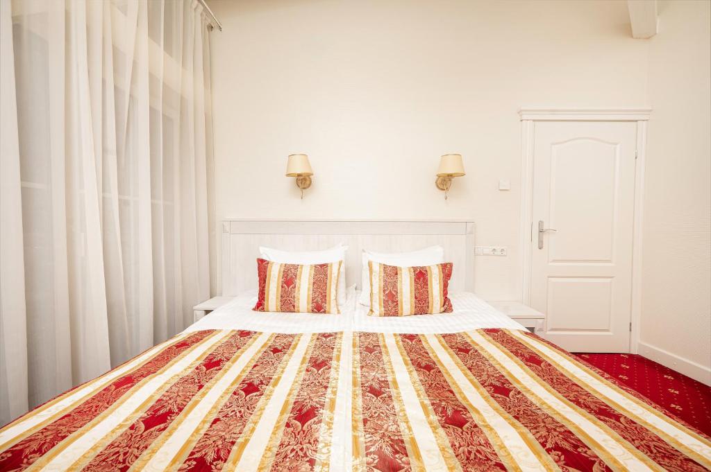 Postel nebo postele na pokoji v ubytování Art Hotel