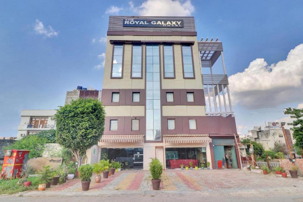 a building with a sign on top of it at The Royal Galaxy - Sec. 12 Dwarka Metro Station in New Delhi