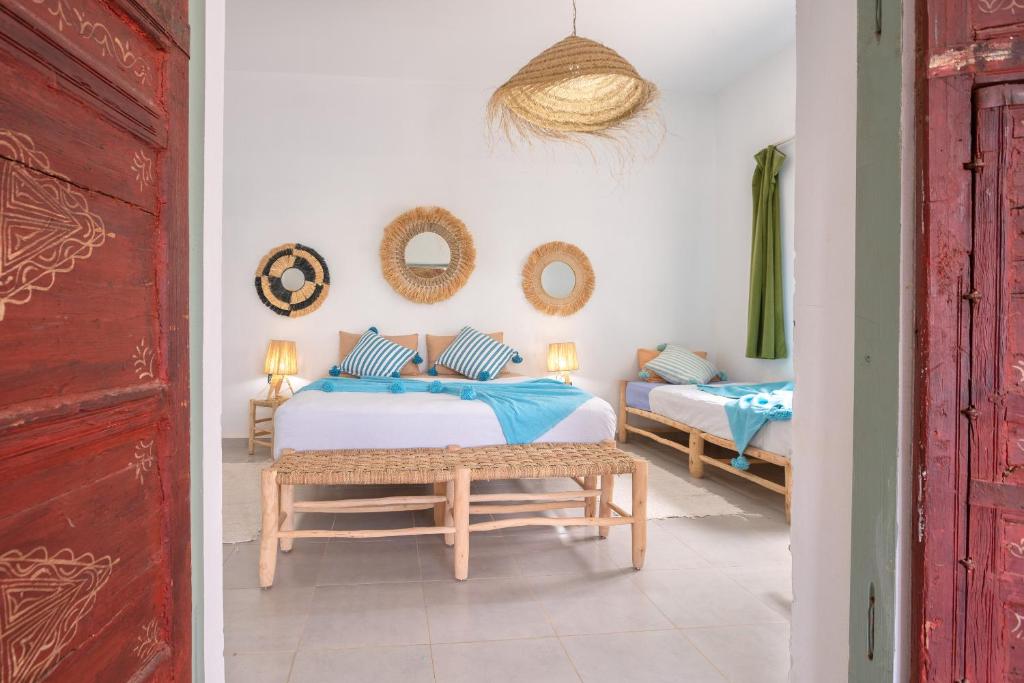Postel nebo postele na pokoji v ubytování La Fattoria Ecolodge