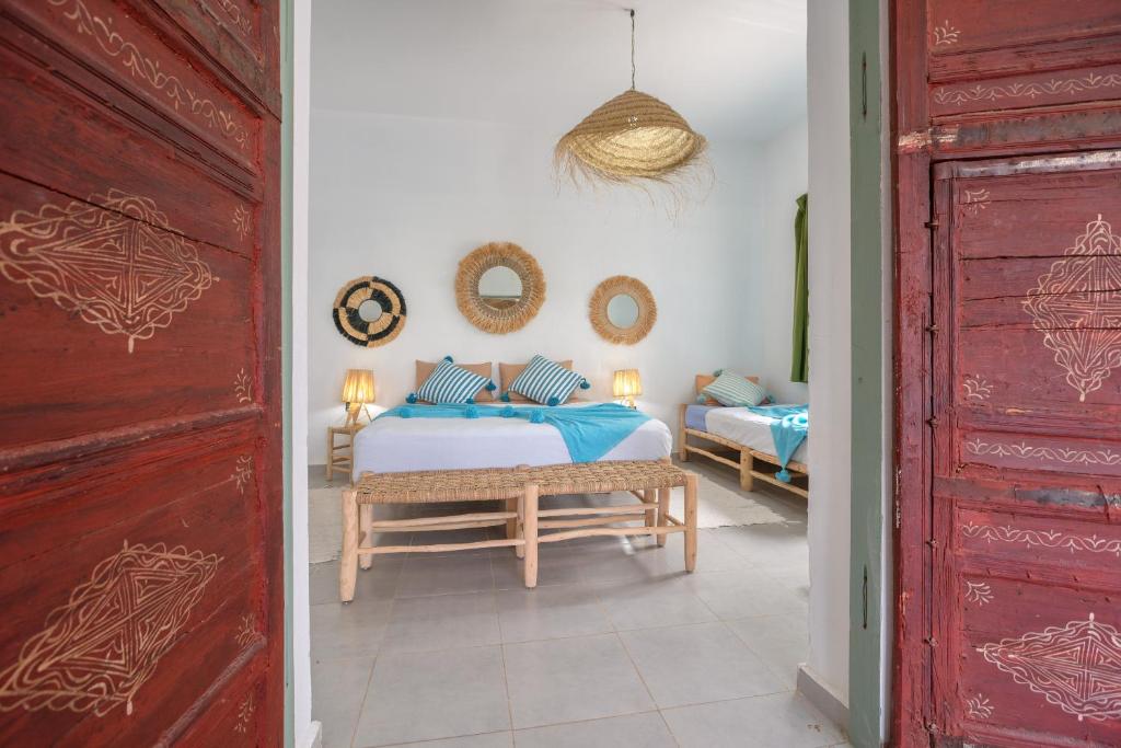 Postel nebo postele na pokoji v ubytování La Fattoria Ecolodge