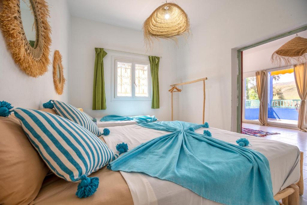 Postel nebo postele na pokoji v ubytování La Fattoria Ecolodge
