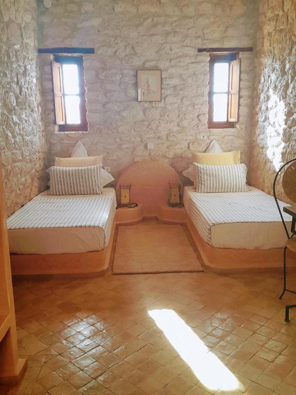 Postel nebo postele na pokoji v ubytování Riad Mamy Wababi