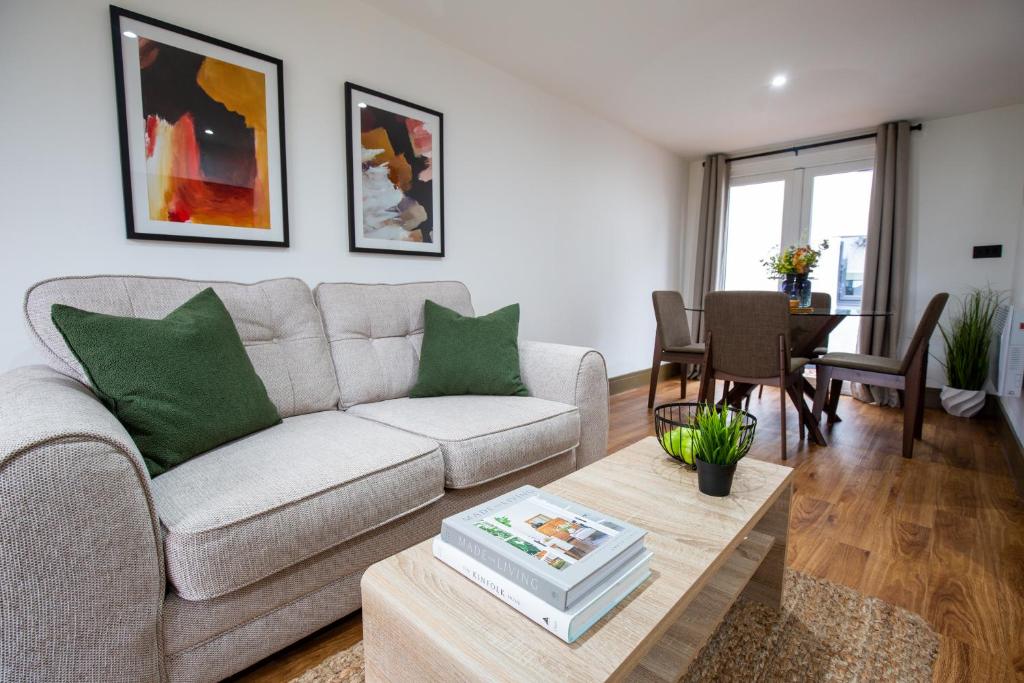 a living room with a couch and a table at RWST Holiday Lodges in Llanrwst