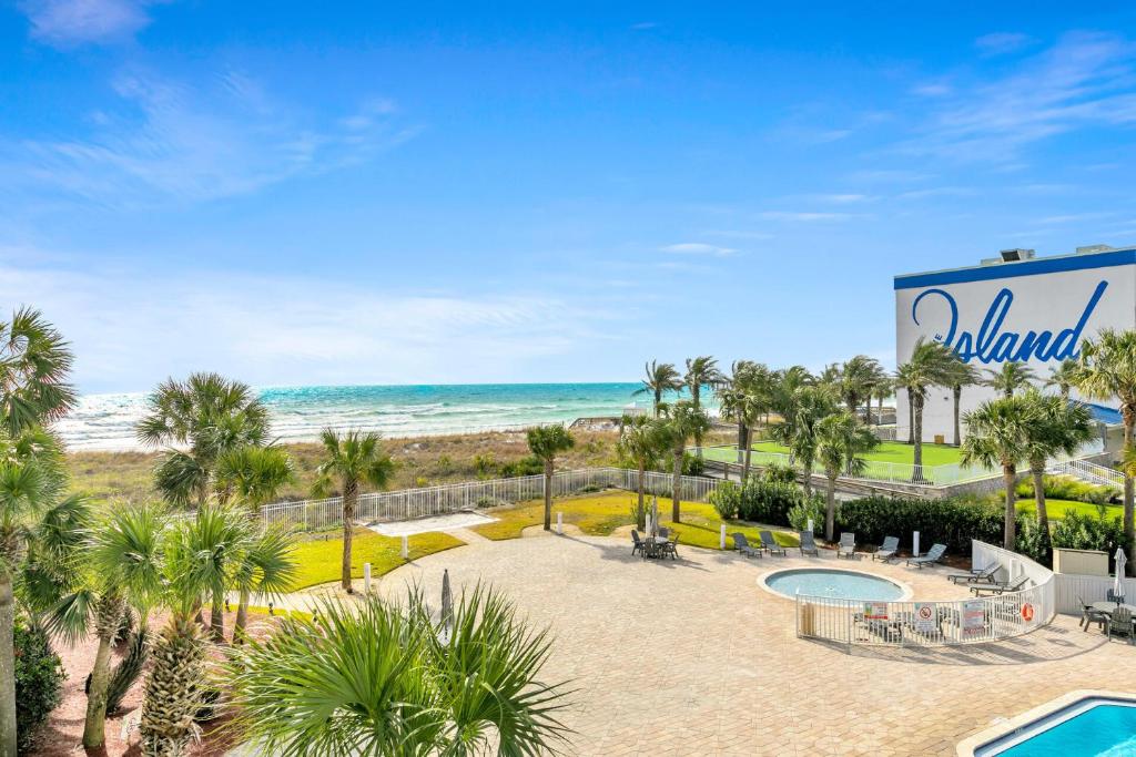 a view of the beach from the balcony of a resort at Destin West Gulfside Two Bedroom with Bunks!!! Lazy River!! in Fort Walton Beach