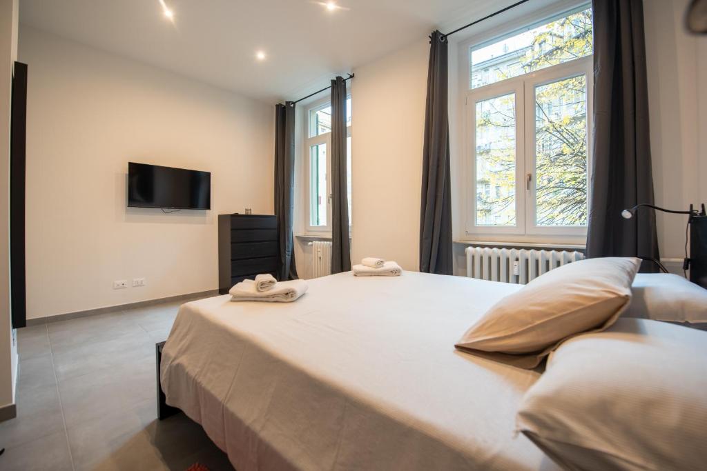 Postel nebo postele na pokoji v ubytování Top Living Apartments - Porta Susa