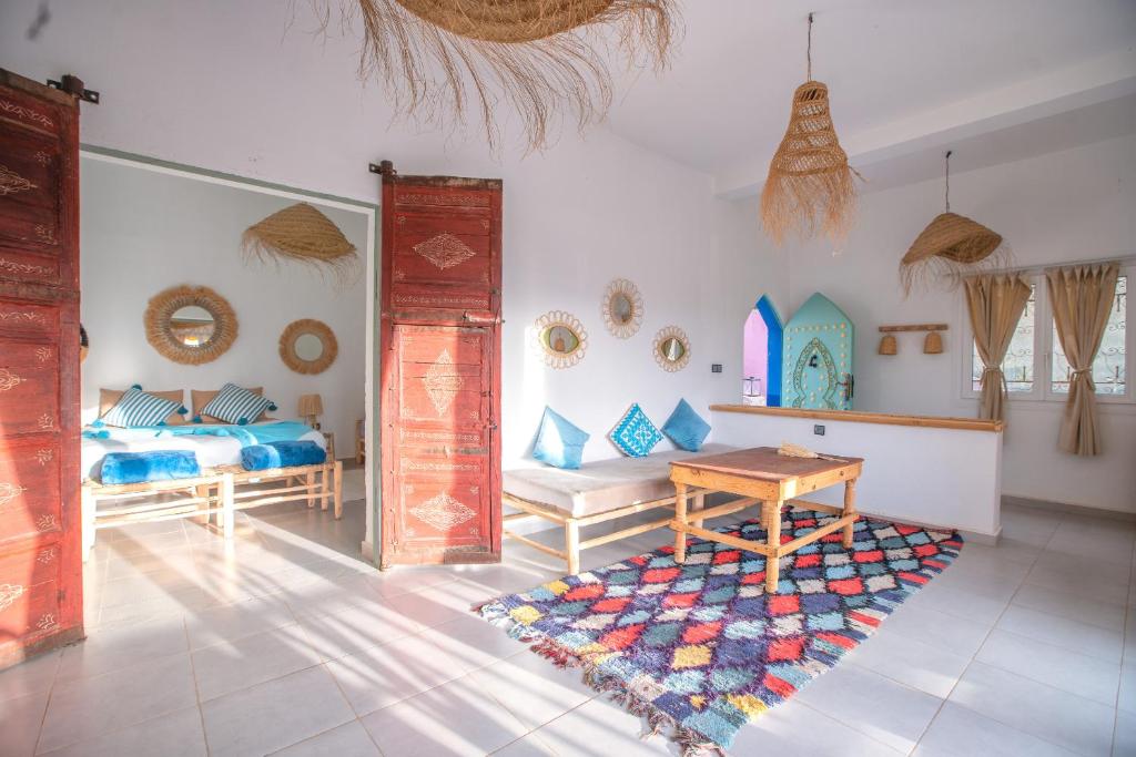 Postel nebo postele na pokoji v ubytování La Fattoria Ecolodge
