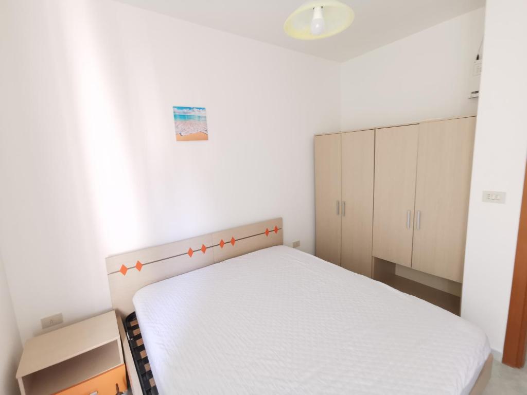 Postel nebo postele na pokoji v ubytování Villetta Borgo Pescatori