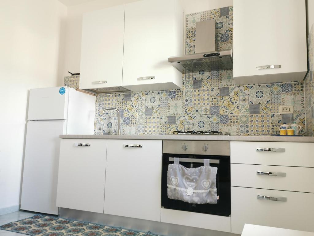 Kuchyň nebo kuchyňský kout v ubytování Villetta Borgo Pescatori
