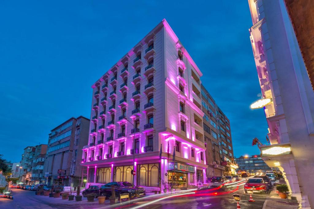 a building with purple lights on the side of it at Green Anka Hotel in Istanbul