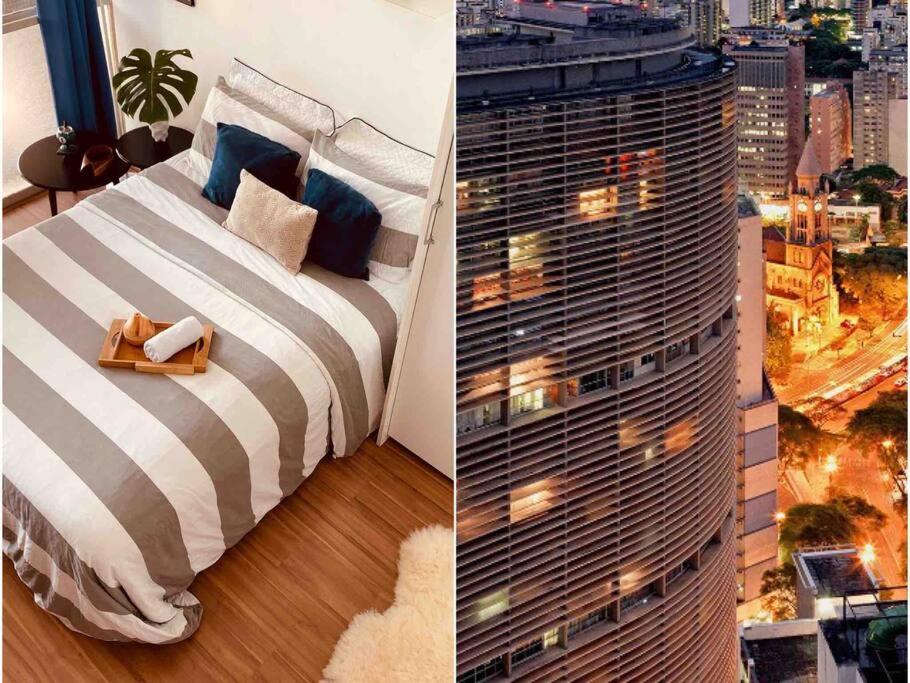 um quarto com uma cama e um edifício alto em Apartamento no Centro - 1 quarto Edifício Copan em São Paulo