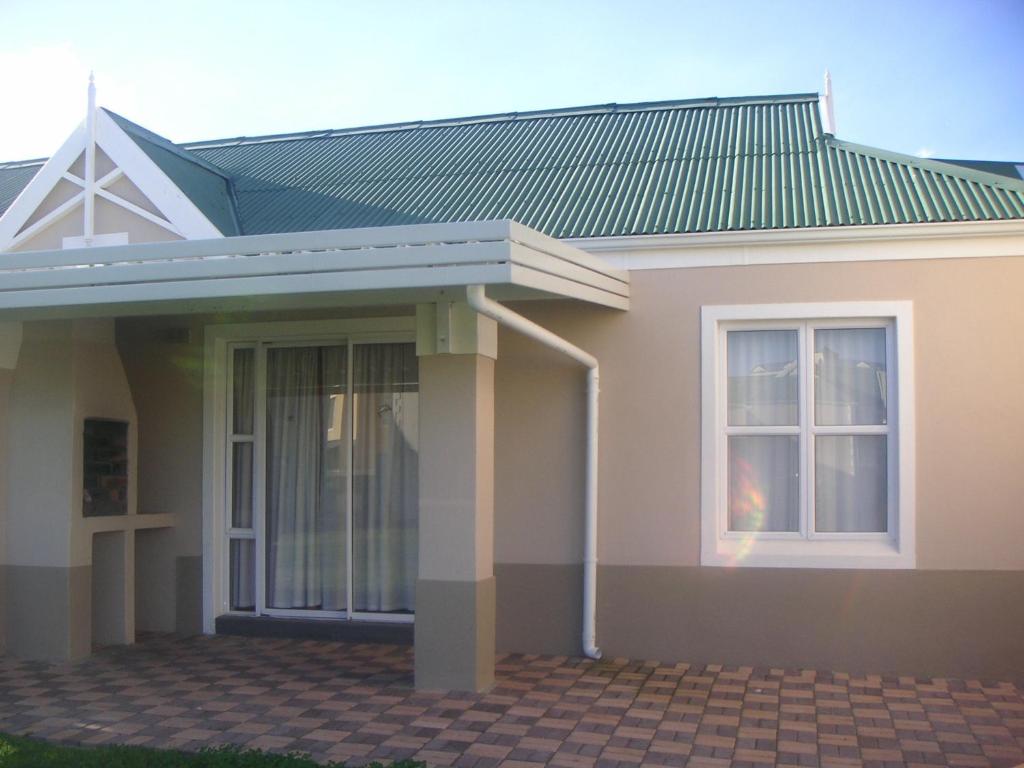 a rendering of a house with a green roof at Waterside Living CL16 in Jeffreys Bay
