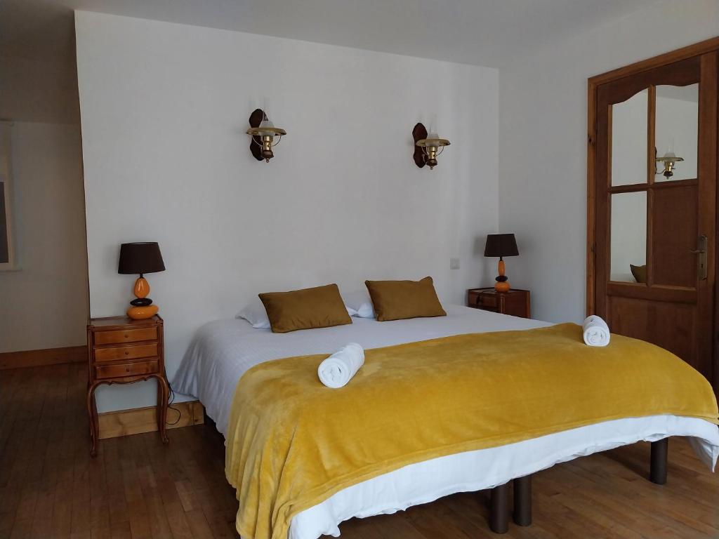 Postel nebo postele na pokoji v ubytování La Maison des Maîtres de Forge