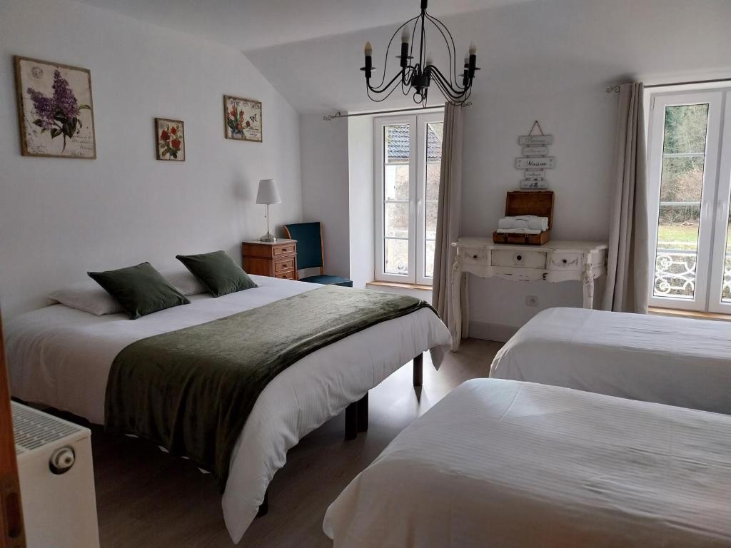 Postel nebo postele na pokoji v ubytování La Maison des Maîtres de Forge