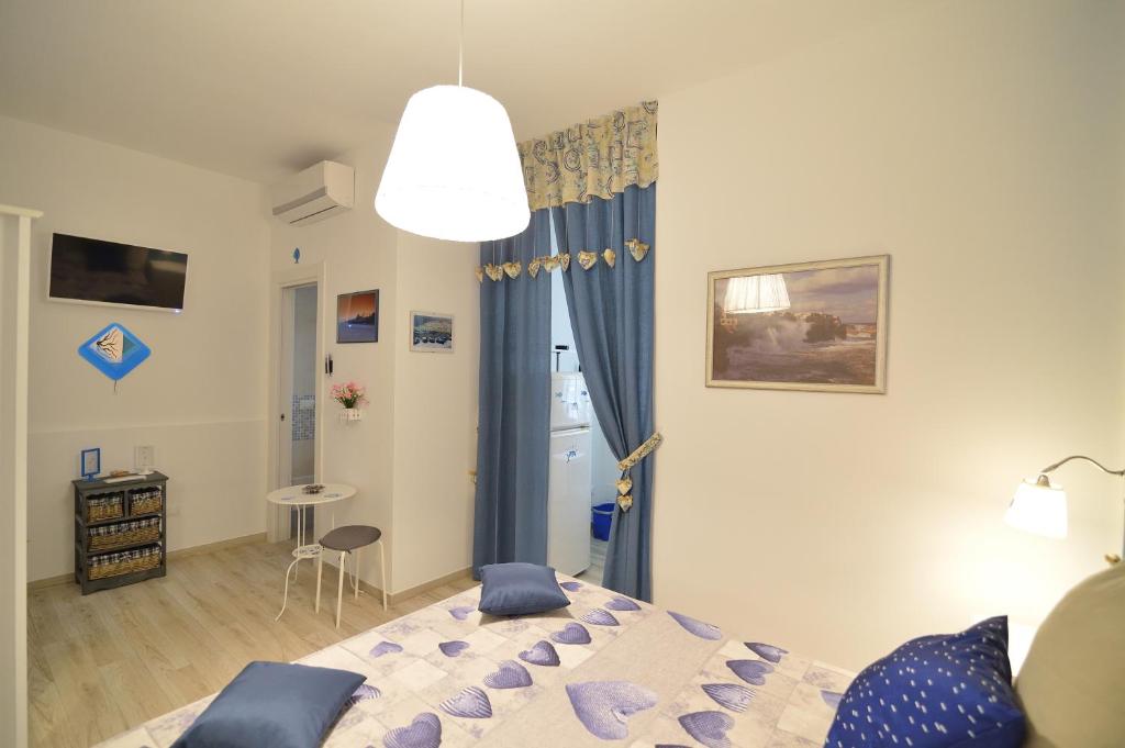 Postel nebo postele na pokoji v ubytování Dimora Pascali - Home & Relax
