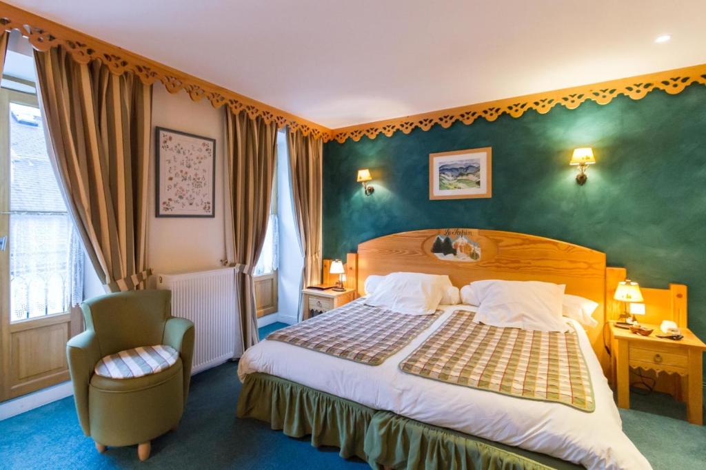 Postel nebo postele na pokoji v ubytování Hôtel Le Bois Joli