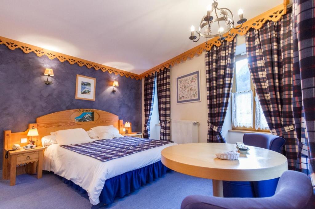 Postel nebo postele na pokoji v ubytování Hôtel Le Bois Joli