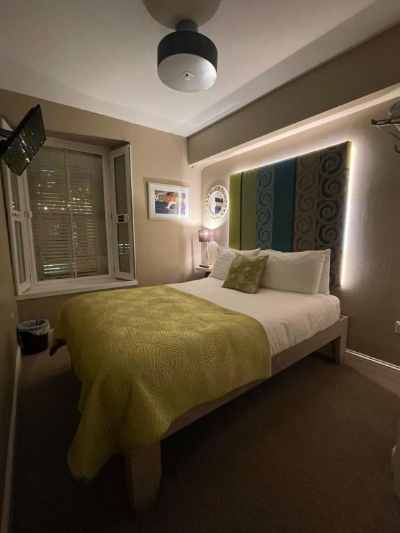 Postel nebo postele na pokoji v ubytování 7 Boutique Hotel