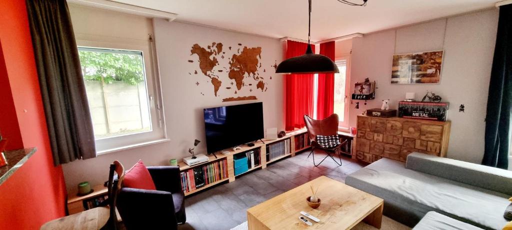 TV a/nebo společenská místnost v ubytování Appartement avec terrasse