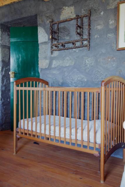 Postel nebo postele na pokoji v ubytování Aldeia das Cagarras