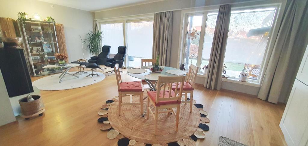 a living room with a table and chairs at Unique, Quiet with Quality - Near the Sea in Horten
