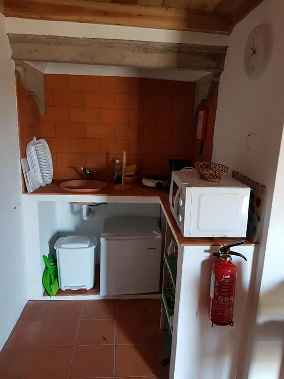 Kuchyň nebo kuchyňský kout v ubytování Aldeia das Cagarras
