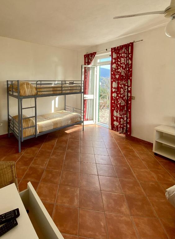 Postel nebo postele na pokoji v ubytování Agriturismo L'Ulivo E Il Mare