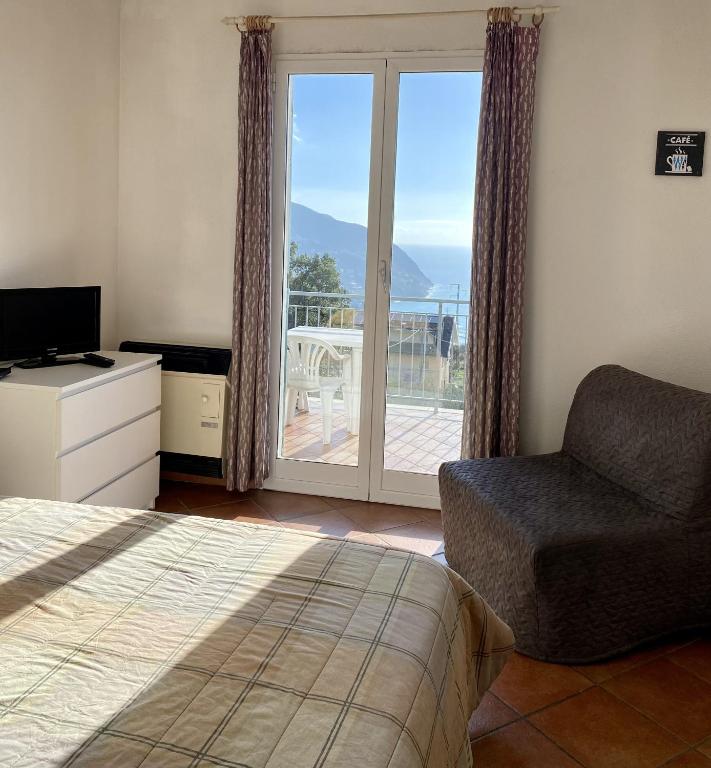 TV a/nebo společenská místnost v ubytování Agriturismo L'Ulivo E Il Mare