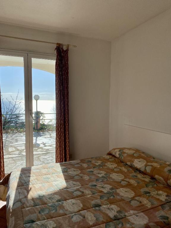 Postel nebo postele na pokoji v ubytování Agriturismo L'Ulivo E Il Mare